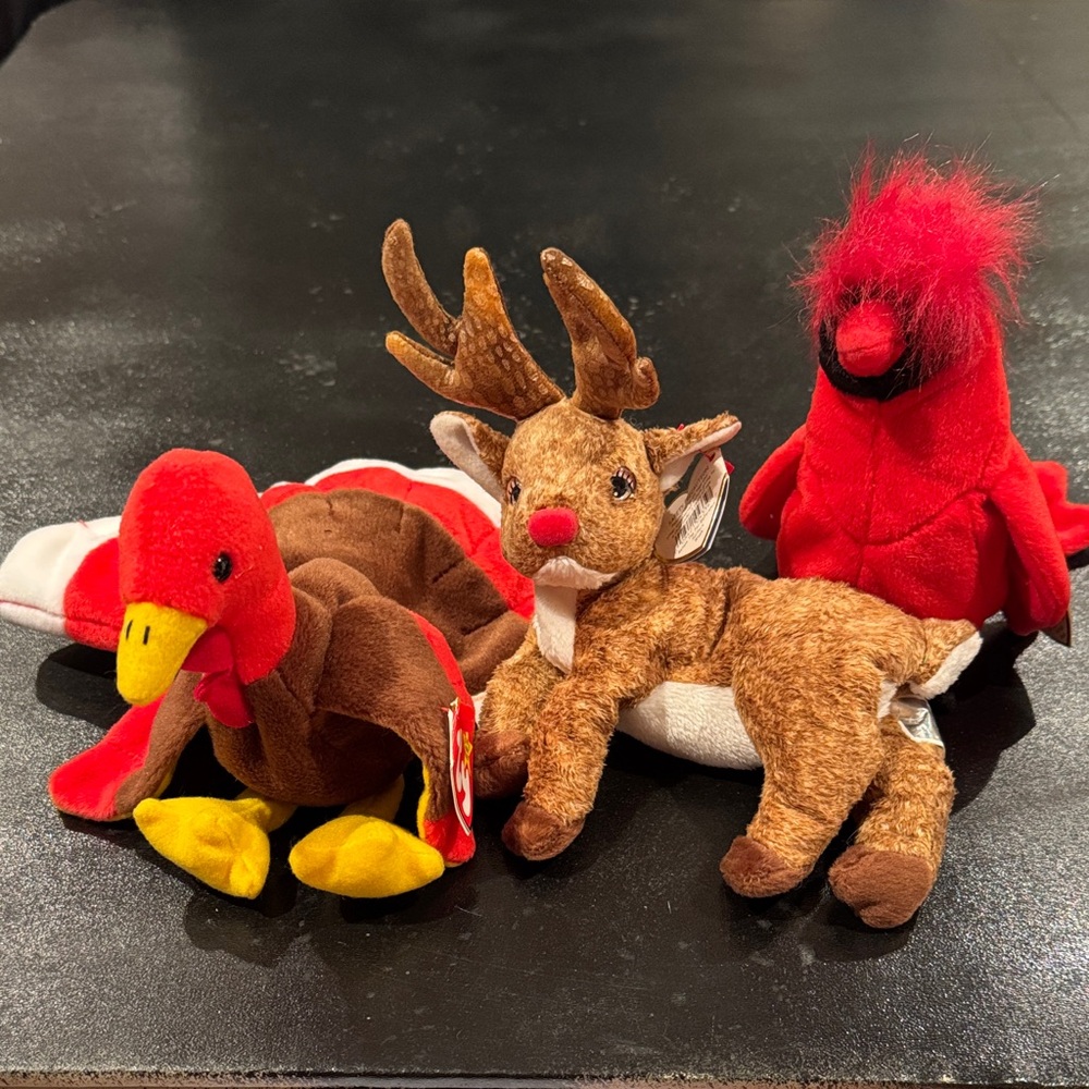 Beanie babies 1998 Cardinal, 2000 Turkey, and 2000 reindeer